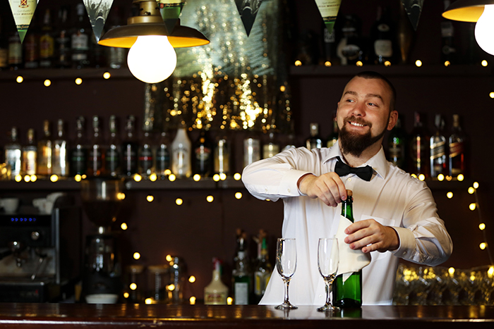 bartender serving guests at wedding